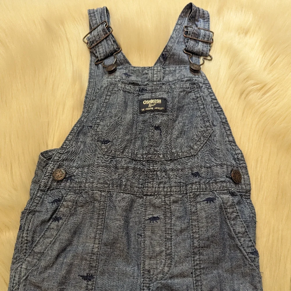 Oshkosh B'gosh blue overalls with navy blue dinosaur print size 2T